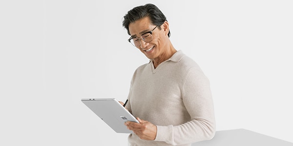 Man holding Surface Pro 10