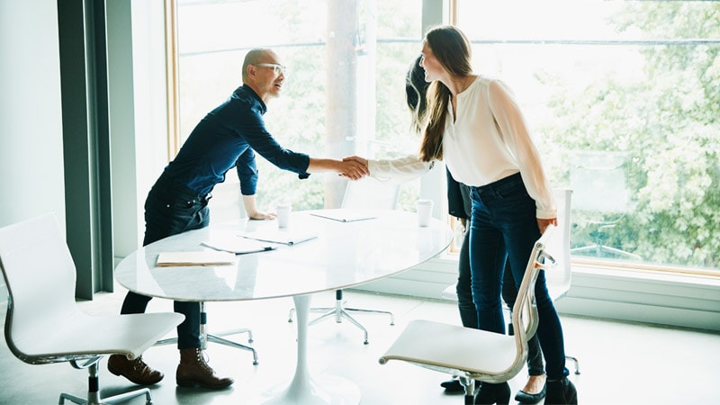 Business associates shaking hands